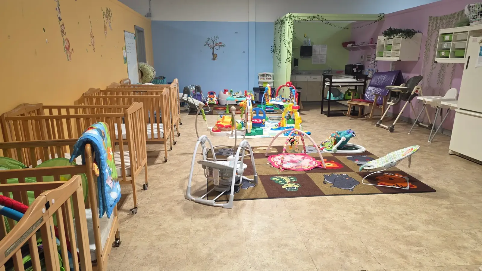 Sunlit Imperial infant room with soft play areas and age-appropriate toys